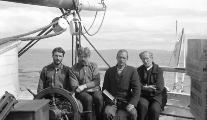 Captain Ejnar Mikkelsen with his crew members